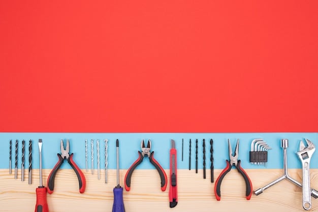 Set of essential tools neatly arranged on a workbench, including wire strippers, screwdrivers, adjustable wrench, PVC cutter, and a multimeter.