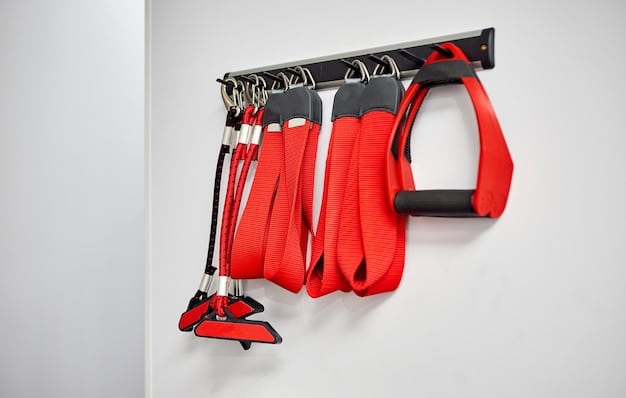 A close-up of wall-mounted storage solutions in a home gym. Resistance bands are neatly hung on hooks, and a yoga mat is rolled up and stored on a shelf. Small weights are organized in a basket, maximizing vertical space.