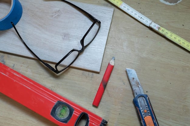 An organized workbench with various tools laid out, including a saw, drill, measuring tape, clamps, and safety glasses, ready for a DIY project.