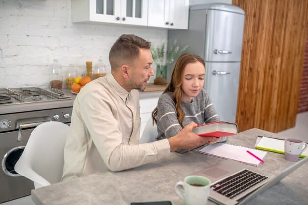 Two parents sitting at a table discussing matters with a notebook open in front of them. They are both looking at each other, showing active listening and engagement. The environment is a neutral space, like a home office or a quiet corner in a living room.