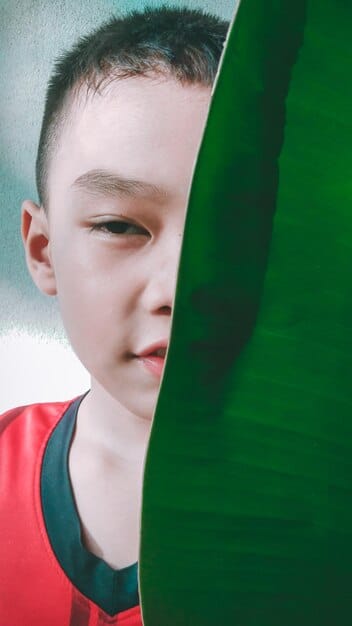 A split-screen showing a child's social media profile on one side and potential negative outcomes (cyberbullying, identity theft) displayed on the other. The image is symbolic of the potential risks of a poorly managed digital footprint.