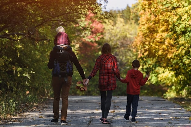 A child smiling while holding hands with both parents during a family outing.