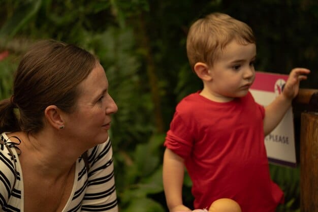 A close-up shot of a single father attentively listening to his child, who is animatedly describing something with hand gestures, showcasing active listening and engagement.