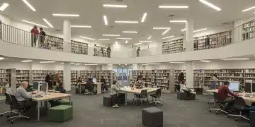 Modern public library with diverse patrons engaging in free educational programs in 2025.